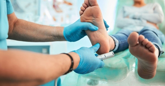 podiatrist treating a patient's foot