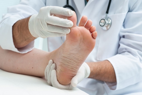 podiatrist-examining-foot